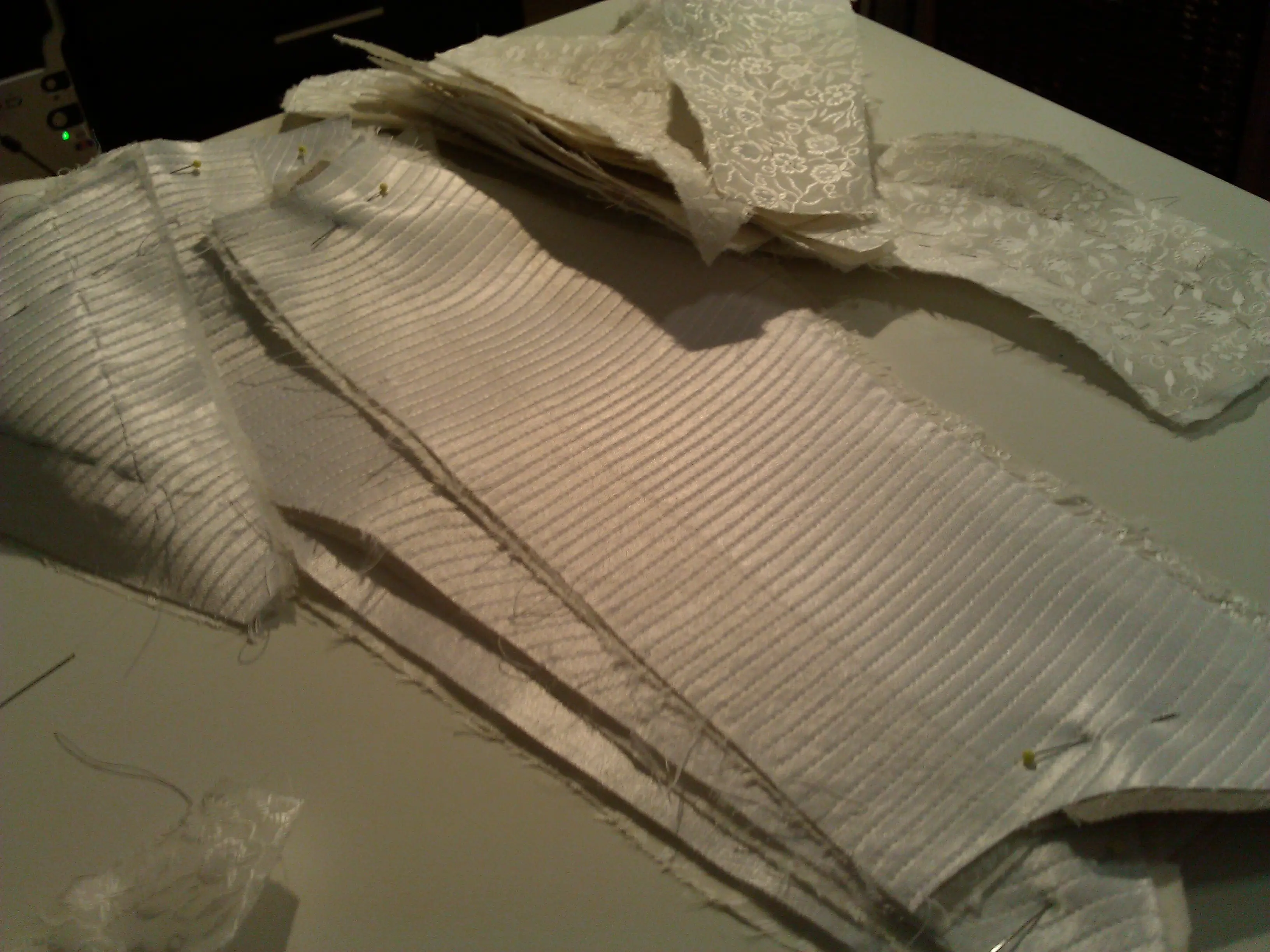 Rows of hand-stitched boning channels on the linen body of the stays